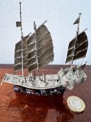 FINELY MODELLED SILVER NAVAL MILITARY CHINESE JUNK UPON CARVED HARDWOOD STAND, APPROX 10.5cm LONG