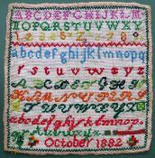 Unframed 1882 sampler. Approx. 33 x 31.5cms used with discolouration and very slight fraying