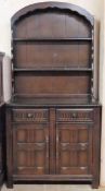 20th century priory style oak linenfold kitchen dresser with plate rack. Approx. 17 x 90 x 41cms