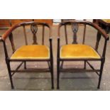Pair of Edwardian inlaid mahogany tub style armchairs, on stretchered supports. Approx. 78 x 53 x