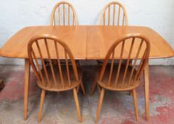 Ercol Golden Dawn extending dining table with fold out leaf and six stick back chairs. Table Approx.