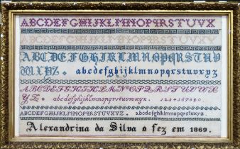 Gilt framed 1869 sampler. Approx. 35 x 57.5cms reasonable used with minor stains. frame chipped in