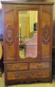 Early 20th century carved fronted mahogany single door mirrored wardrobe, fitted with three