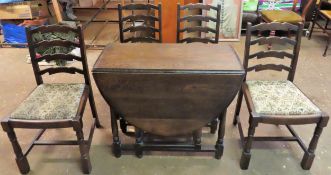 Early/mid 20th century oak priory style gateleg dining table, with four ladderback chairs to