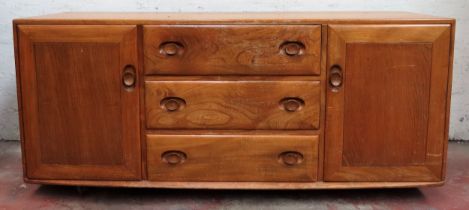 Ercol Golden Dawn three drawer sideboard. Approx. 69 x 155 x 43cms used with scuffs scratches and