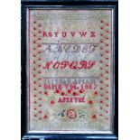 Ebonised framed 1887 sampler. Approx. 43.5 x 29cms used with discolouration. glass cracked