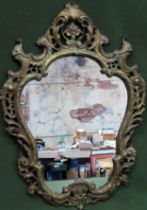 Victorian style gilt metal framed ornately decorated wall mirror. Approx. 62 x 44.5cms reasonable