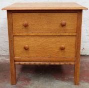 Small oak two drawer bedroom chest. Approx. 63 x 61 x 45.5cms reasonable used condition. back