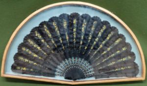 Vintage gilded and glazed display case containing large hand painted, ebonised and gilded hand