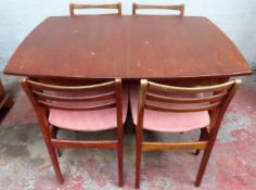 White and Newton mid 20th century teak extending dining table with fold out leaf, and four dining