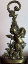 19th century decorative brass cherub form door stop. Approx. 49cms H reasonable used condition