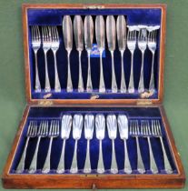 Early 20th century oak cased set of 12 fish knives and forks used and unchecked