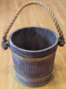 Vintage brass bound small bucket with original rope handle. Approx. 32 x 49cms used with wear due to