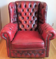 Vintage Ox Blood red leather button back wing armchair. Approx. 90 x 57 x 88cms reasonable used