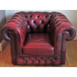 Vintage Ox Blood red leather button back Chesterfield armchair. Approx. 69 x 107 x 83cms