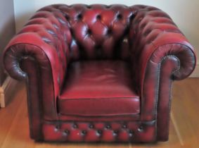 Vintage Ox Blood red leather button back Chesterfield armchair. Approx. 69 x 107 x 83cms