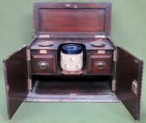 Early 20th cnetury oak two door smokers cabinet, with original tobacco jar. Approx. 30 x 46 x