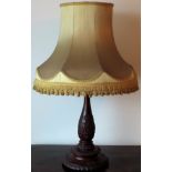 Early 20th century heavily carved mahogany table lamp, with shade. Approx. 52cms H reasonable used
