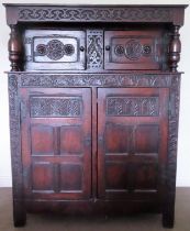 Late 19th/early 20th century dark oak heavily carved court cupboard. Approx. 146 x 114 x 45cms