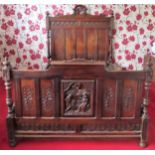 Impressive heavily carved oak double bed frame comprising headboard, footboard, side panels and