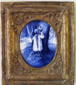 19th century English Delft style gilded edged blue and white oval ceramic panel, within a gilded