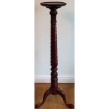 20th century mahogany twist decorated tall torchere stand, on tripod supports. Approx. 136cms H
