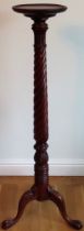 20th century mahogany twist decorated tall torchere stand, on tripod supports. Approx. 136cms H