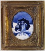 19th century English Delft style gilded edged blue and white oval ceramic panel, within a gilded
