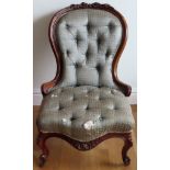 Early Victorian carved walnut framed low seated button back nursing chair. Approx. 90 x 56 x 50cms