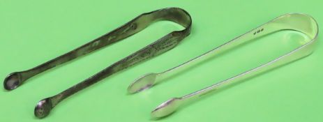 Two pairs of Hallmarked silver sugar tongs. Total Approx. 60g both used and unchecked