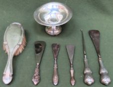 Mixed lot of silver Inc. stemmed tazza sweet dish, various silver handled shoe horns, dressing brush
