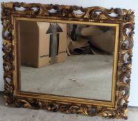 Victorian gilded and piercework decorated wall mirror. Approx. 79 x 67cms