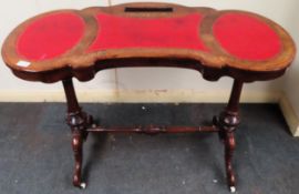 Victorian walnut shaped topped writing table with leather inserts, Circa. 1860