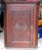 19th century carved fronted oak wall mounting corner cupboard. Approx. 103 x 82 x 47cms