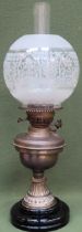 Early 20th century brass oil lamp with glass shade. Approx. 57cms H used and unchecked