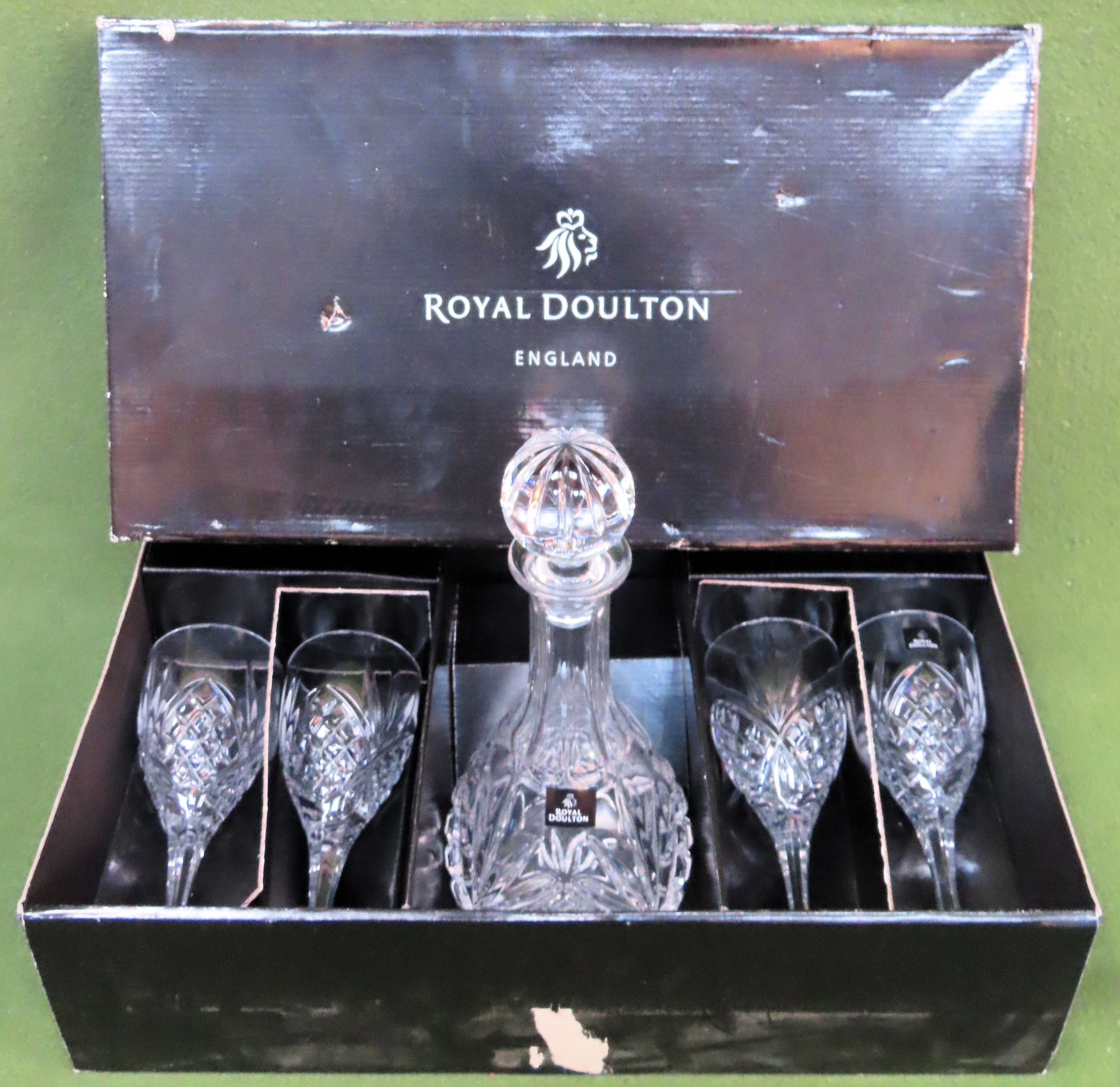 Boxed Royal Doulton glass decanter, plus four glasses to accord All in used condition, unchecked