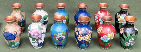 Set of 12 (6 pairs) of various Japanese cloisonné vases, all with floral decoration. Approx. 11cms H