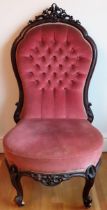 19th century carved mahogany framed and upholstered low button back nursing chair. Approx. 112 x