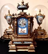 FRENCH GILDED CLOCK AND GARNITURES WITH ENAMEL PANELS DEPICTING CHERUBS, BIRDS AND FLORAL SPRAYS,