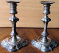 Pair of George II 18th century hallmarked silver candlesticks, by James Gould, London assay