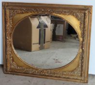 20th century decorative gilded rectangular framed oval mirror. Approx. 66 x 76cms reasonable used