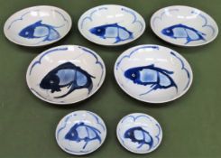 Seven various sixed Chinese blue and white bowls, decorated with fish. Larger bowls Approx. 23cms