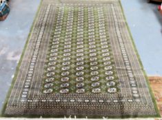 Large Middle Eastern style green decorative floor rug. Approx. 292cms x 191cms