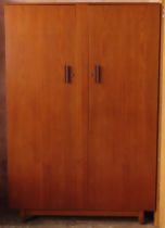 1970's style teak two door wardrobe. Approx. 179cm H x 120cm W x 55cm D Appears in reasonable used