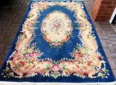 Decorative Chinese floral decorated floor rug. Approx. 239 x 150cms