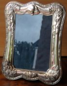 Hallmarked silver repousse decorated photograph frame. Approx. 24 x 20cms