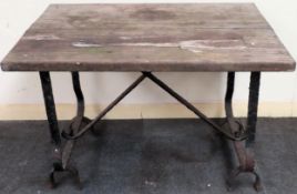 Vintage wooden topped garden table on cast iron supports. Approx. 62cm H x 92cm W x 65cm D Used