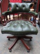 20th century leather upholstered button back captains armchair. Approx. 85cm H x 63cm W x 56cm D