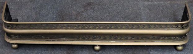 Victorian piercework decorated brass fire kerb. Approx. 22cm H x 114cm W x 26cm D Reasonable used
