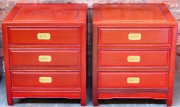 Pair of 20th century Chinese hardwood three drawer chests with campaign style handles. Approx. 56